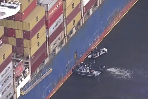 FBI agents get on board the cargo ship Dali on Monday, April 15, 2024 in Baltimore. The FBI is conducting a criminal investigation into the deadly collapse of the Francis Scott Key Bridge that is focused on the circumstances leading up to it and whether all federal laws were followed, according to someone familiar with the matter.