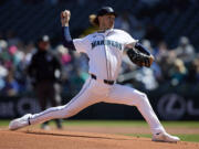 Seattle Mariners pitcher Bryce Miller throws to a Cincinnati Reds batter during the first inning of a baseball game, Wednesday, April 17, 2024, in Seattle.