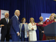 Kerry Kennedy, right, introduces President Joe Biden, second from left, at a campaign event, Thursday, April 18, 2024, in Philadelphia. Pictured from left are members of the Kennedy family Maxwell Kennedy Sr., Kathleen Kennedy Townsend, Rory Kennedy and Christopher Kennedy.