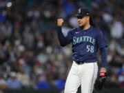 Seattle Mariners starting pitcher Luis Castillo reacts while walking off the field after facing the against the Atlanta Braves through the seventh inning of a baseball game Tuesday, April 30, 2024, in Seattle.