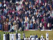 Muslim devotees, including women in the background, offer Eid al-Fitr prayers to mark the end of Ramadan, the Islamic holy month of fasting, in Nairobi, Kenya Wednesday, April. 10, 2024.
