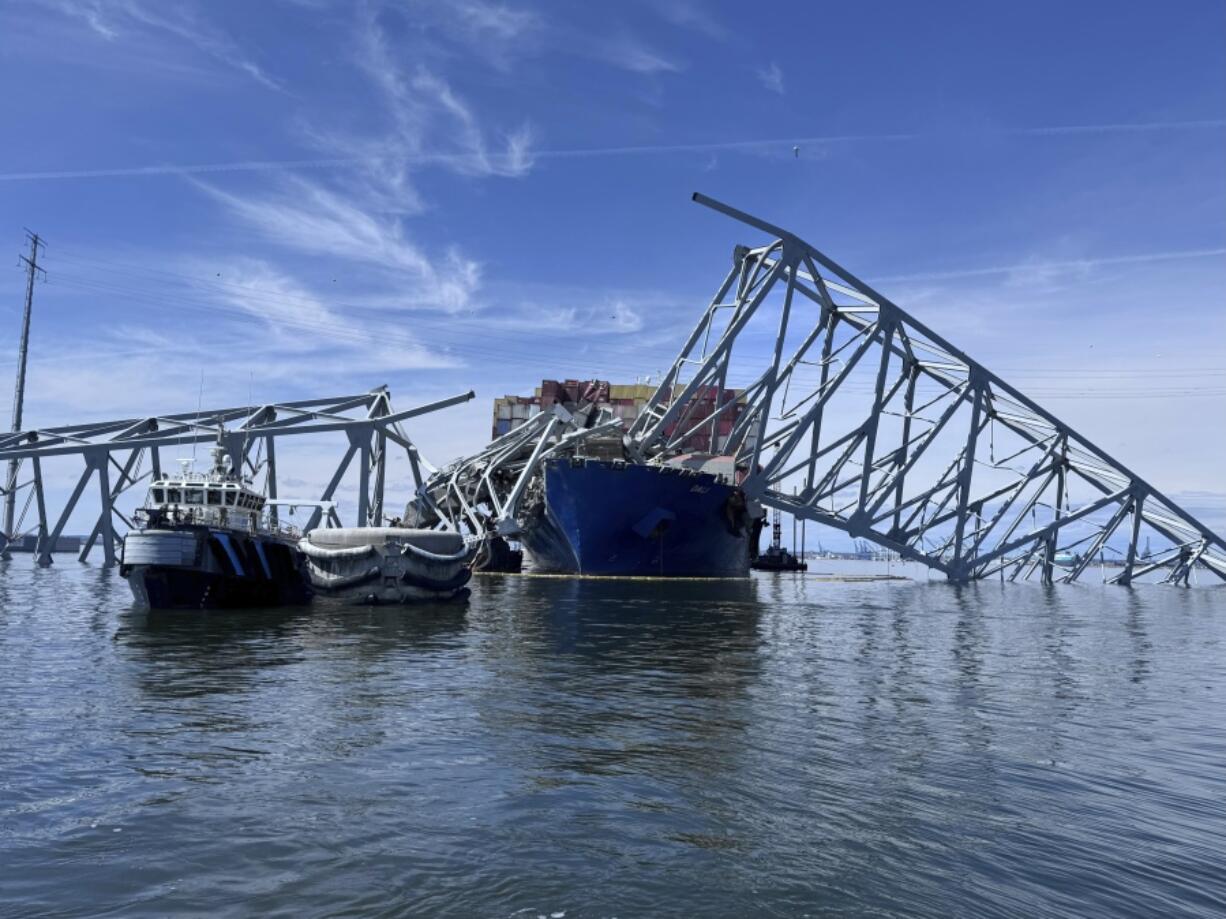 The fallen Francis Scott Key Bridge in Baltimore is pictured Sunday, March 31, 2024, where divers assisted crews with the complicated and meticulous operation of removing steel and concrete.