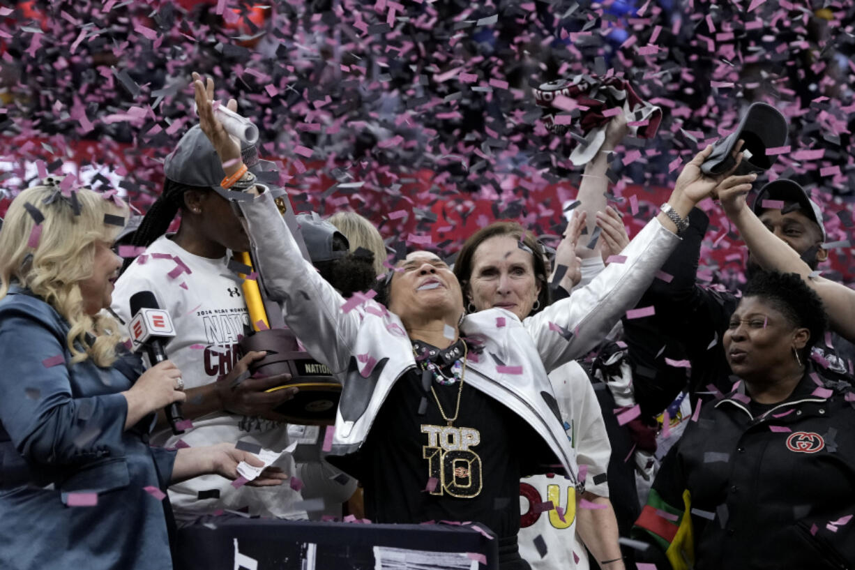 South Carolina head coach Dawn Staley celebrates after the Final Four college basketball championship game against Iowa in the women&#039;s NCAA Tournament, Sunday, April 7, 2024, in Cleveland. South Carolina won 87-75.