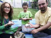 This family photo shows Ryan Corbett holding rabbits with his daughter Miriam and son Caleb in Kabul, Afghanistan in 2020. Lawyers for Corbett, believed held by the Taliban for nearly two years, are asking a United Nations human rights investigator to intervene, citing what they say is cruel and inhumane treatment. Corbett was abducted on August 10, 2022 after returning to Afghanistan, where he and his family had been living at the time of the collapse of the U.S.-based government there one year earlier, on a valid 12-month business visa to pay and train staff.