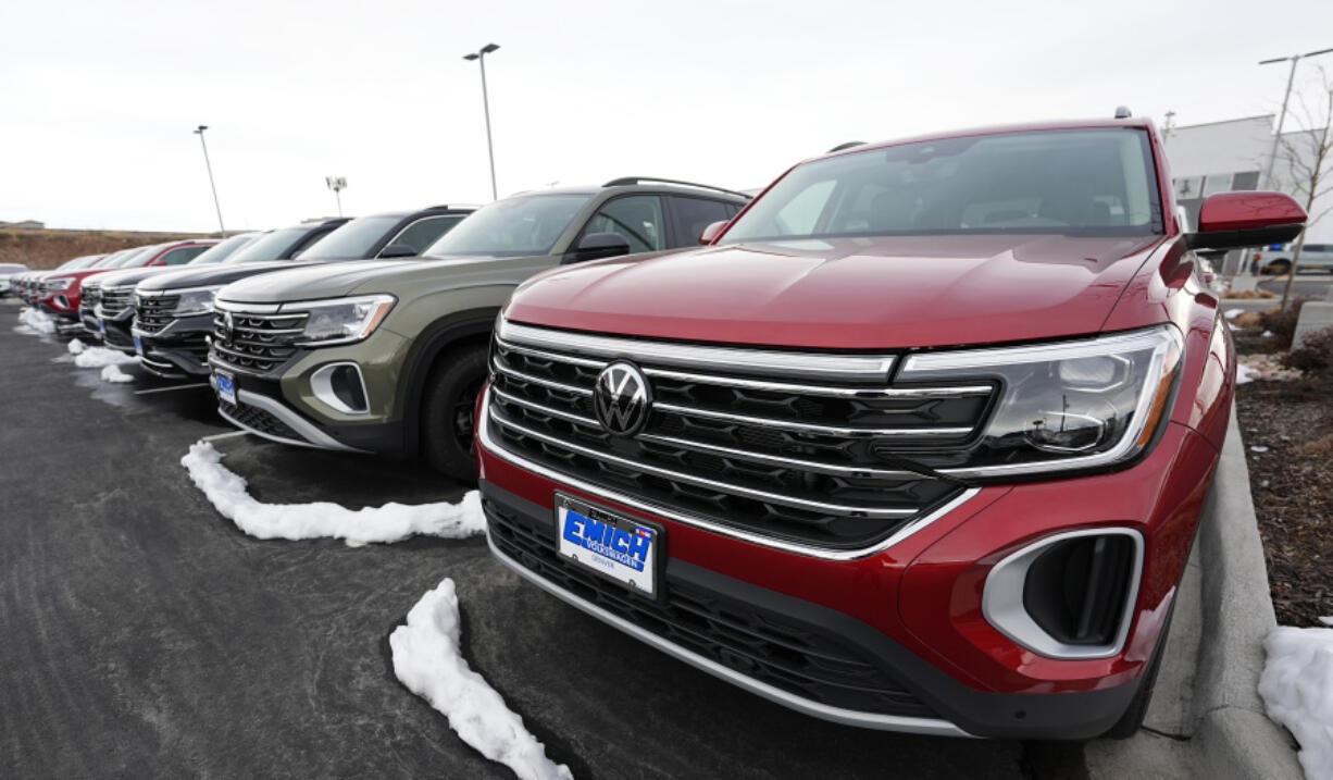 A line of unsold 2024 Atlas sports-utility vehicles sits at a Volkswagen dealership Sunday, March 17, 2024, in Denver. Most automakers who sell new vehicles in the U.S. report first-quarter sales numbers on Tuesday, April 2, 2024. Sales are expected to be surprisingly strong despite high interest rates.