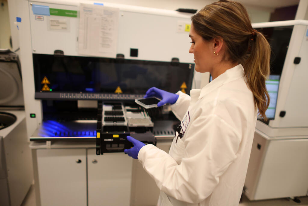 Liza Knez, a senior technologist at the Kaiser Permanente Northern California Regional Laboratory, demonstrates the use of a cell free DNA analysis unit on Monday, April 1, 2023, in San Jose, California. The new genomics lab will expand diagnostic testing capabilities and provide early screening and intervention for its 4.5 million members.