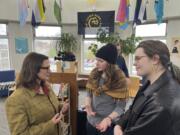 Bloomington Jefferson senior Shae Ross, center, joined Lieutenant Governor Peggy Flanagan, left, at an event promoting proposed legislation to prevent books bans based on ideology at Como Park High School in St. Paul, Minn., on March 21, 2024.