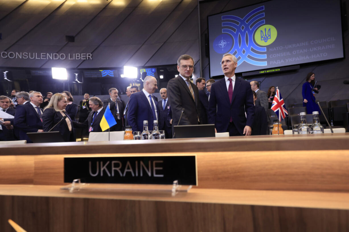 NATO Secretary General Jens Stoltenberg, center, speaks with Ukraine&rsquo;s Foreign Minister Dmytro Kuleba, center left, during a meeting of the NATO-Ukraine Council at NATO headquarters in Brussels, Thursday, April 4, 2024. NATO celebrates on Thursday 75 years of collective defense across Europe and North America as Russia&rsquo;s war on Ukraine enters its third year.