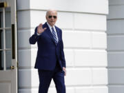 President Joe Biden waves as he walks out of the White House in Washington, Thursday, April 25, 2024, before departing on a trip to New York.