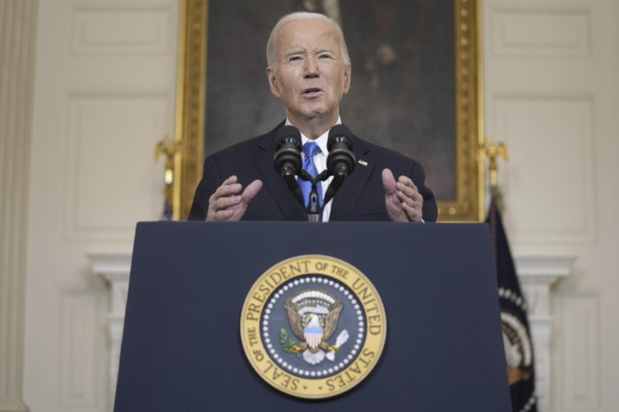 FILE - President Joe Biden speaks about a $95 billion aid package that would help Ukraine in their war against Russia, in the State Dining Room of the White House, Feb. 13, 2024, in Washington.