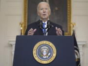 FILE - President Joe Biden speaks about a $95 billion aid package that would help Ukraine in their war against Russia, in the State Dining Room of the White House, Feb. 13, 2024, in Washington.