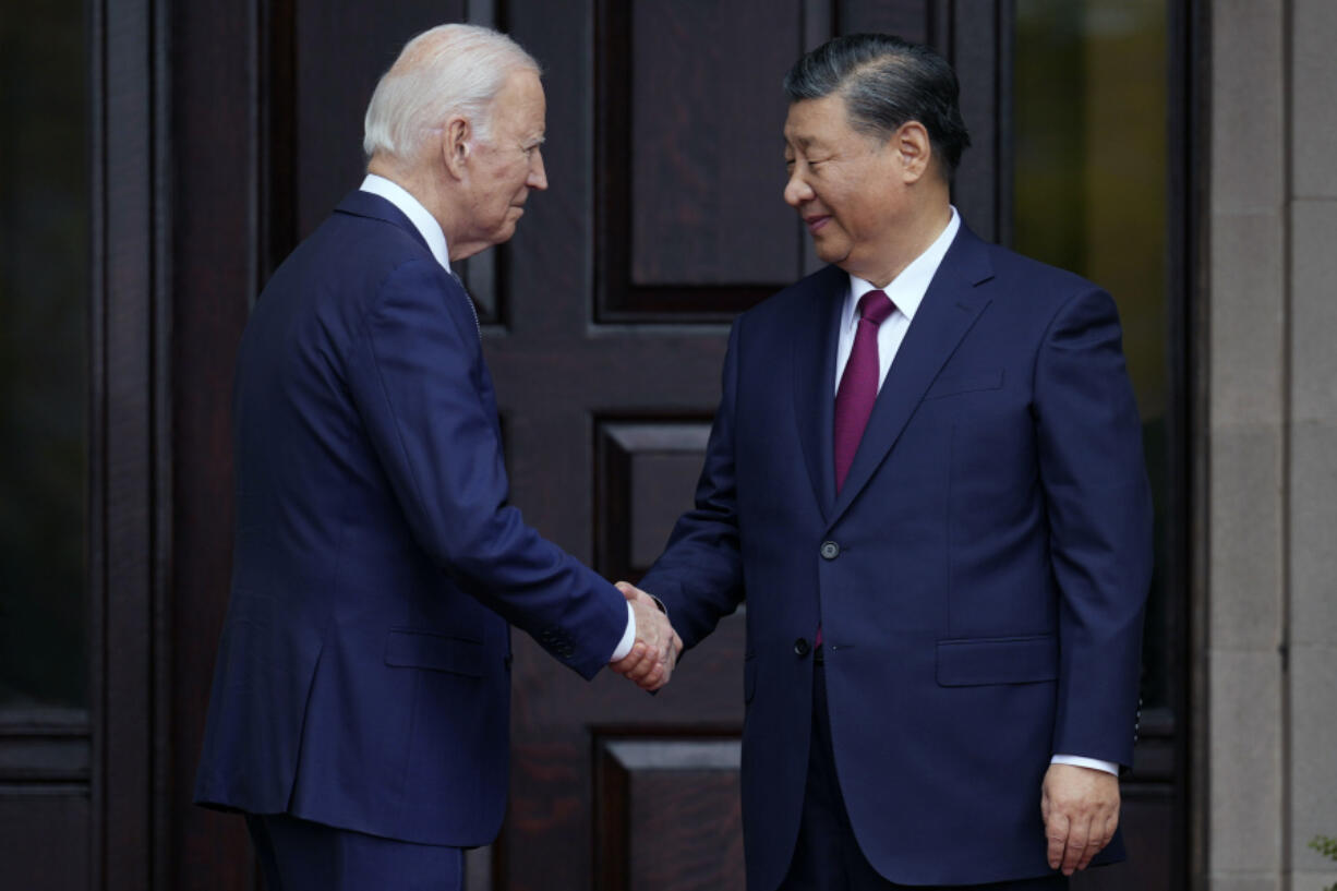 FILE - President Joe Biden greets China&#039;s President President Xi Jinping at the Filoli Estate in Woodside, Calif., Nov, 15, 2023, on the sidelines of the Asia-Pacific Economic Cooperative conference. Biden and Xi spoke Tuesday in their first call since their November summit in California, Chinese state media reported.