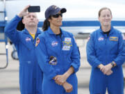 NASA astronaut Suni Williams with support crew in the background speaks to the media after arriving at the Kennedy Space Center, Thursday, April 25, 2024, in Cape Canaveral, Fla. The two test pilot crew will launch aboard Boeing&rsquo;s Starliner capsule atop an Atlas rocket to the International Space Station, scheduled for liftoff on May 6, 2024.