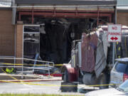 A stolen 18-wheeler crashed into a Texas Department of Public Safety office on US-290 in Brenham, Texas on Friday, April 12, 2024.  The driver of a stolen semitrailer intentionally rammed it into the Texas public safety office in a rural town west of Houston on Friday, injuring multiple people, according to a state lawmaker.