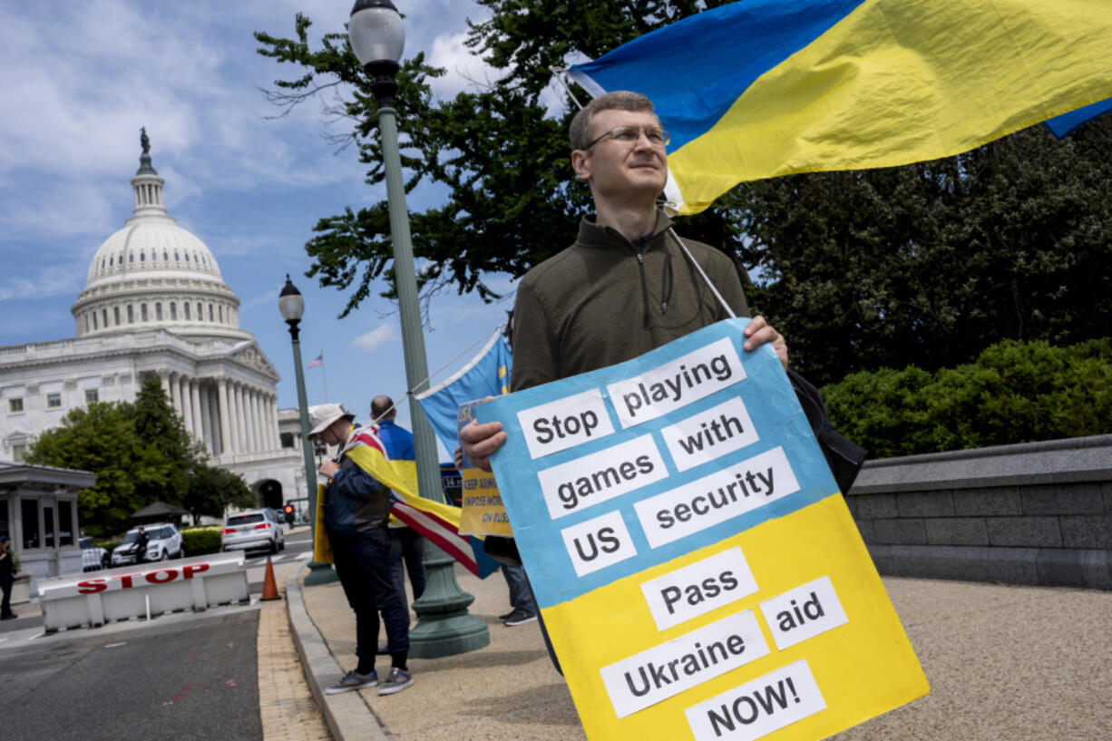 Activists supporting Ukraine demonstrate outside the Capitol in Washington, Saturday, April 20, 2024, as the House prepares to vote on approval of $95 billion in foreign aid for Ukraine, Israel and other U.S. allies. (AP Photo/J.