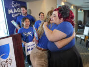 Disneyland Resort Cast Members, Courtney Griffith, left, hugs Angela Nichols after a news conference in Anaheim, Calif., Wednesday, April 17, 2024. Workers who help bring Disneyland&#039;s beloved characters to life said Wednesday they collected enough signatures to support their push for a union.