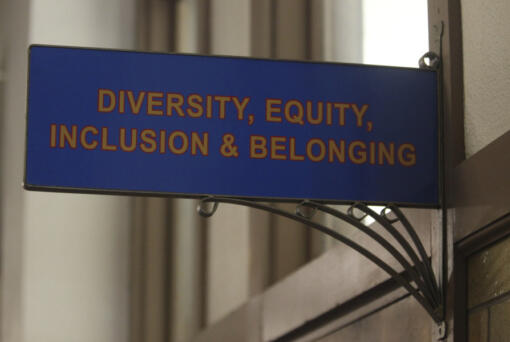 FILE - The sign above the door to the Office of Diversity, Equity, Inclusion and Belonging inside the main administration building on the main University of Kansas campus is seen on Friday, April 12, 2024, in Lawrence, Kan. A conservative quest to limit diversity, equity and inclusion initiatives is gaining momentum in state capitals and college governing boards, with officials in about one-third of the states now taking some sort of action against it.