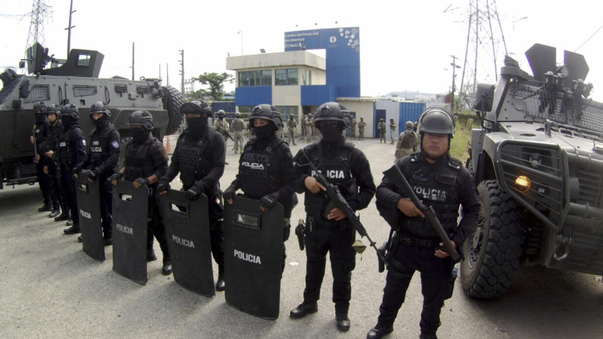 Police stand guard at the entrance of the penitentiary where former Vice President Jorge Glas is being held, in Guayaquil, Ecuador, Saturday, April 6, 2024. Ecuadorian police broke through the external doors of the Mexican Embassy in Quito, Friday evening, to arrest Glas, who had been residing there since December.