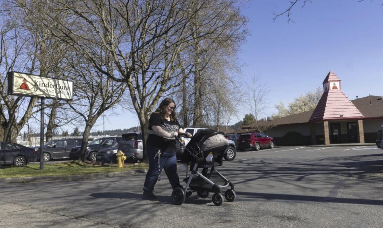 Nicole Slemp, a new mother of seven-month-old William, pushes her son in his stroller past KinderCare, which is near the family&rsquo;s home Thursday, March 14, 2024 in Auburn, Wash. Slemp recently quit her job because she and her husband couldn&rsquo;t find child care they could afford. Expensive, scarce child care is putting Puget Sound parents out of work. (Ellen M.