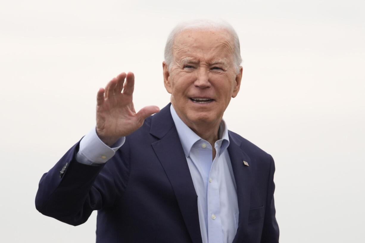 President Joe Biden waves as he arrives to board Air Force One, Thursday, March 28, 2024, at Andrews Air Force Base, Md. Biden is headed to New York for a fundraiser.