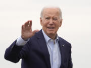 President Joe Biden waves as he arrives to board Air Force One, Thursday, March 28, 2024, at Andrews Air Force Base, Md. Biden is headed to New York for a fundraiser.