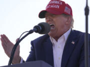 FILE - Republican presidential candidate former President Donald Trump speaks at a campaign rally March 16, 2024, in Vandalia, Ohio. Trump&rsquo;s anti-immigrant rhetoric appears to be making inroads even among some Democrats, a worrying sign for President Joe Biden.