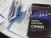 Educational materials provided by the Committee of Safe and Secure Elections are pictured at a conference with local election and law enforcement officials Wednesday, April 10, 2024, in Traverse City, Mich. A top concern for local election workers throughout the country this year is their own safety. The committee, formed after the 2020 presidential election, is traveling the country helping them prepare for what could lie ahead and making sure they are connected to local law enforcement. (AP Photo/John L.