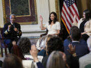 Ashley Judd, center, Shelby Rowe, right, Executive Director of the Suicide Prevention Research Center, and others in the audience raise their hands after Surgeon General Dr. Vivek Murthy, left, asked the group if any of the them knew a person in crisis during an event on the White House complex in Washington, Tuesday, April 23, 2024, with notable suicide prevention advocates. The White House held the event on the day they released the 2024 National Strategy for Suicide Prevention to highlight efforts to tackle the mental health crisis and beat the overdose crisis.