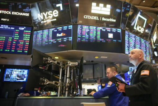 Traders work on the floor of the New York Stock Exchange shortly after the opening bell, Wednesday, April 24, 2024, in New York.