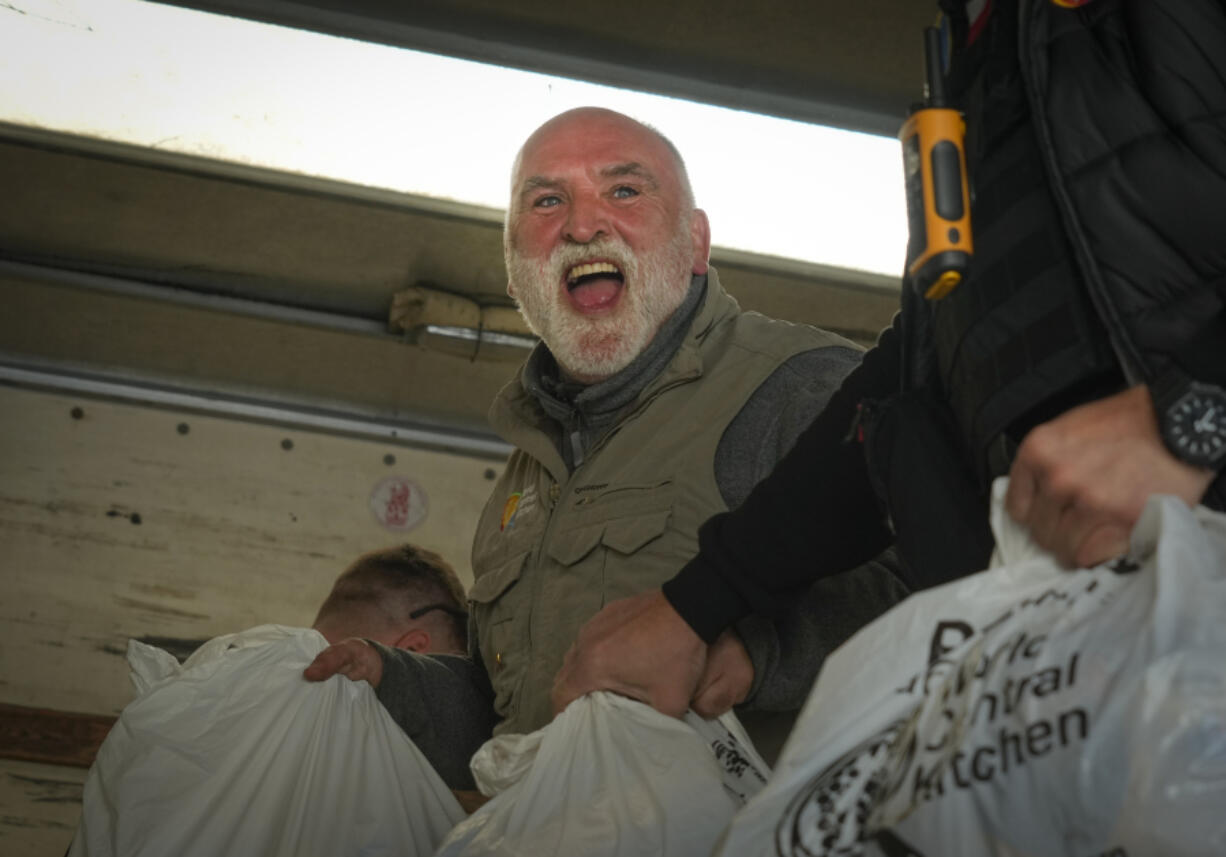 FILE - Jose Andres, a Spanish chef, and founder of World Central Kitchen unloads the humanitarian food packages delivered with WCK&rsquo;s truck in Kherson, Ukraine, on Nov. 15, 2022. World Central Kitchen, called a halt to its work in the Gaza Strip after an apparent Israeli strike killed seven of its workers, mostly foreigners.