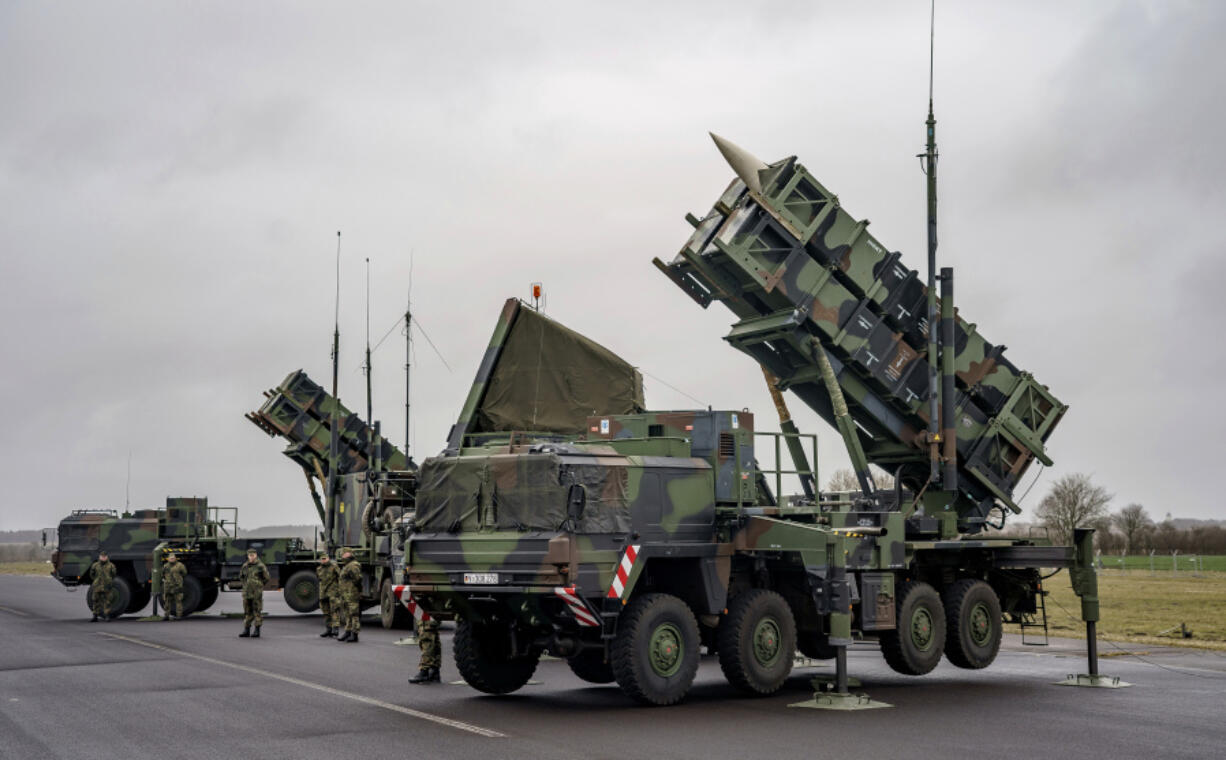 FILE - Ready-for-combat &ldquo;Patriot&rdquo; anti-aircraft missile systems of the German forces Bundeswehr&rsquo;s anti-aircraft missile squadron 1 stand on the airfield of military airport during a media presentation in Schwesing, Germany, Thursday, March 17, 2022. German Chancellor Olaf Scholz said he had discussed the &ldquo;massive&rdquo; Russian air attacks on civilian energy infrastructure with Ukrainian President Volodymyr Zelenskyy on Saturday. &ldquo;We stand unbreakably at Ukraine&rsquo;s side,&rdquo; Scholz said in a post on the social media platform X.