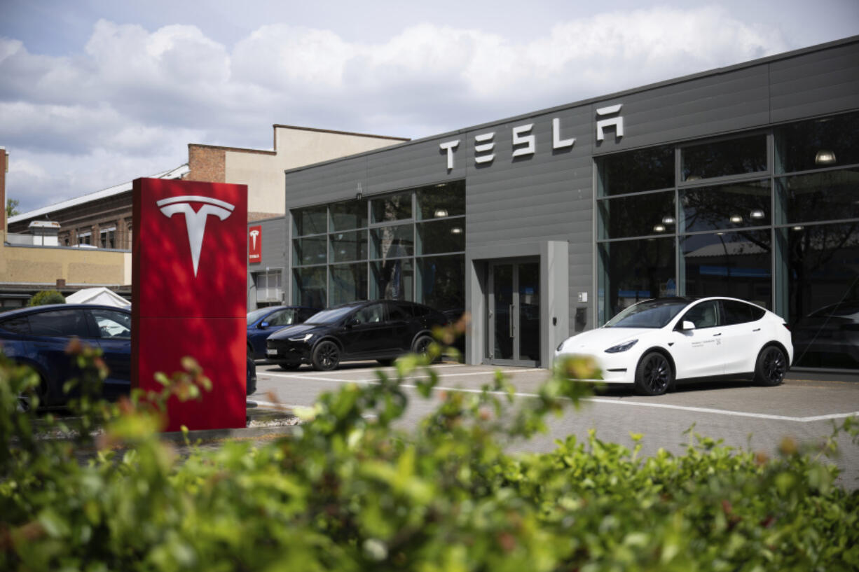 Cars are parked at a Tesla dealership in Berlin Tuesday, April 23, 2024.