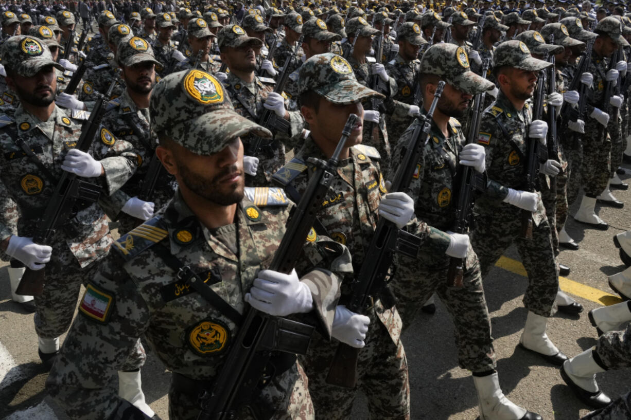 Iranian army members march during Army Day parade at a military base in northern Tehran, Iran, Wednesday, April 17, 2024. In the parade, President Ebrahim Raisi warned that the &ldquo;tiniest invasion&rdquo; by Israel would bring a &ldquo;massive and harsh&rdquo; response, as the region braces for potential Israeli retaliation after Iran&rsquo;s attack over the weekend.