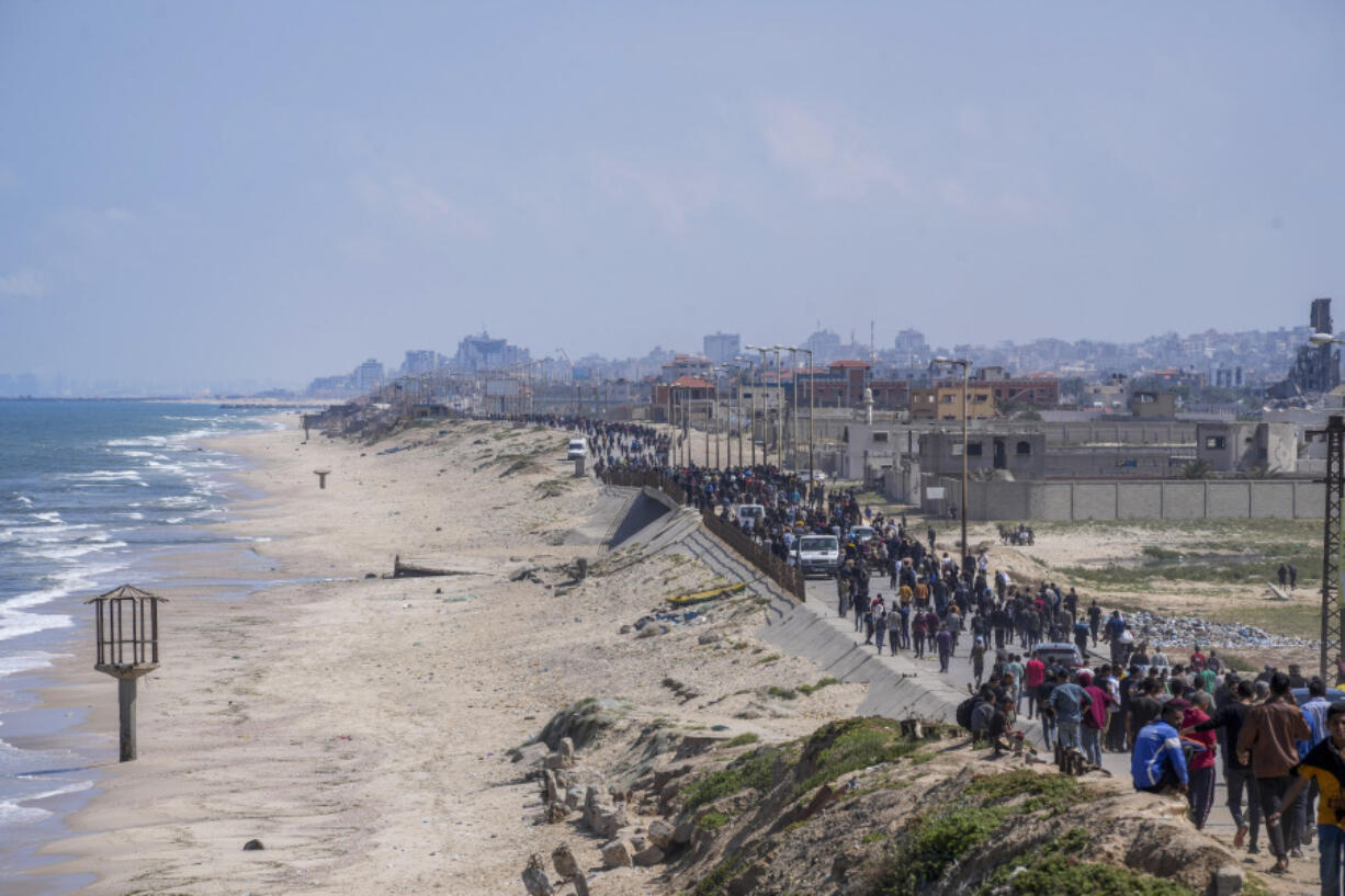 Displaced Palestinians trying to walk back from central Gaza Strip to northern Gaza Strip , Sunday, April 14, 2024.
