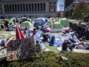 FILE - A sign sits erected at the pro-Palestinian demonstration encampment at Columbia University in New York, Monday, April 22, 2024.