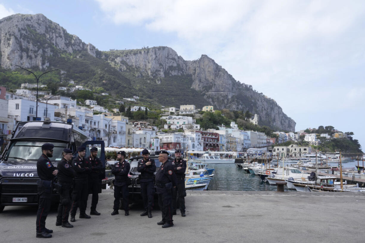 Italian Carabinieri paramilitary policemen gather at the Capri&rsquo;s harbour, Wednesday, April 17, 2024. Group of Seven foreign ministers are meeting on the Italian resort island of Capri, with soaring tensions in the Mideast and Russia&rsquo;s continuing war in Ukraine topping the agenda. The meeting runs April 17-19.