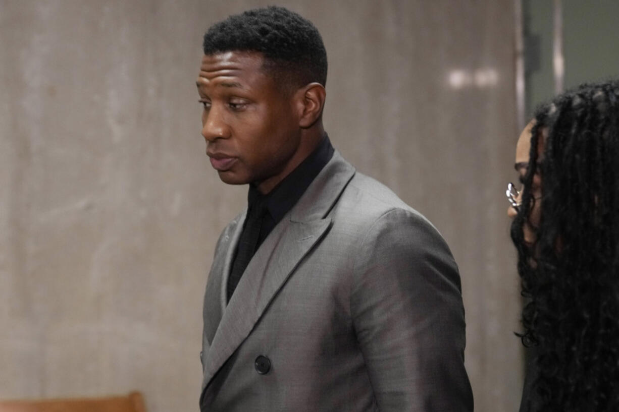 FILE - Jonathan Majors leaves a courtroom in New York, Dec. 18, 2023. Majors is scheduled to be sentenced Monday, April 8, 2024 in a New York court after he was convicted of assaulting his former girlfriend.