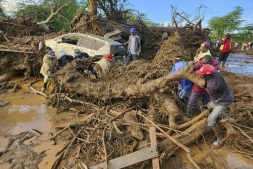 People try to clear the area after a dam burst, in Kamuchiri Village Mai Mahiu, Nakuru County, Kenya, Monday, April 29, 2024. Police in Kenya say at least 40 people have died after a dam collapsed in the country&rsquo;s west.