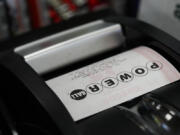 A Powerball is printed at a 7-Eleven on Friday, April 5, 2024, in Portland, Ore.