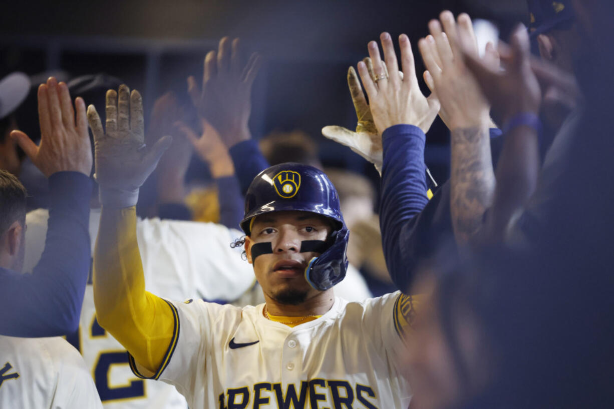 Milwaukee Brewers&#039; William Contreras (24) reacts after his two-run home run during the second inning of a baseball game against the Seattle Mariners Sunday, April 7, 2024, in Milwaukee.