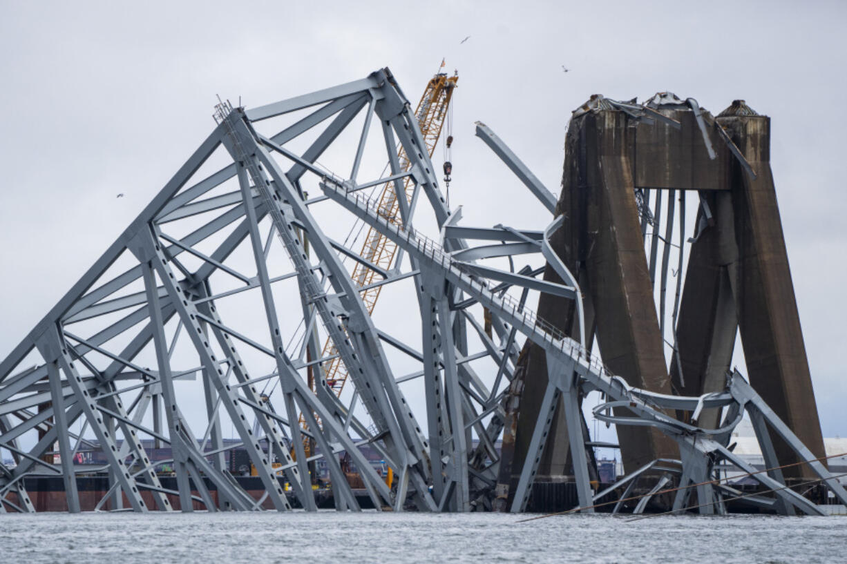 A section of the damaged and collapsed Francis Scott Key Bridge is seen, in the Baltimore port, Monday, April 1, 2024.