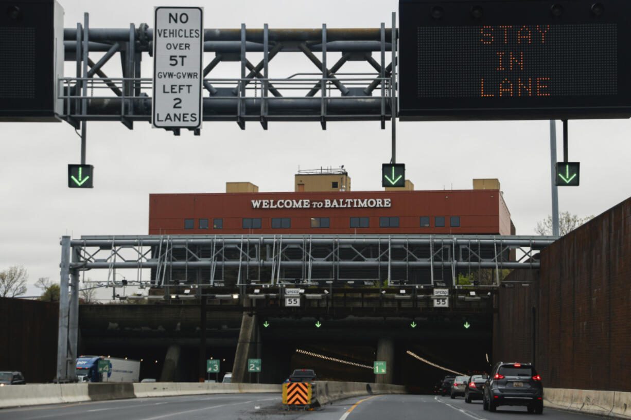 Cars drive through the Fort McHenry Tunnel, Tuesday, April 2, 2024, in Baltimore.