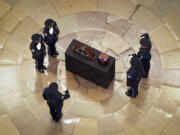 An honor guard salutes during a ceremony where the remains of retired Army Col. Ralph Puckett Jr., the last surviving Medal of Honor recipient for acts performed during the Korean War, lie in honor in the Rotunda at the Capitol in Washington, Monday, April 29, 2024. Puckett died on April 8 at his home in Columbus, Ga., at the age of 97.