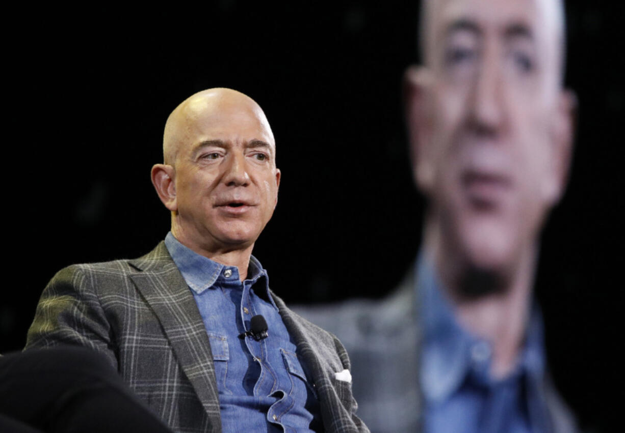 FILE - Amazon CEO Jeff Bezos speaks at the Amazon re:MARS convention in Las Vegas on June 6, 2019.  Most news organizations hold its journalists to strict ethical standards to avoid conflicts of interest either real or perceived. Is the same true for its bosses?