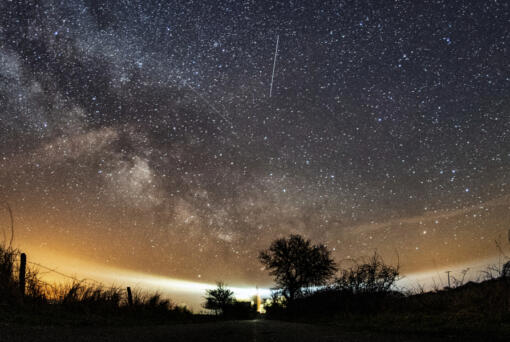 FILE - The Lyrid meteor shower is seen over Burg on the Baltic Sea island of Fehmarn off Germany, Friday, April 20, 2018. The Lyrids occur every year in mid-to-late April. Peak activity for 2024 happens Sunday, April 21 into Monday, April 22, with 10 to 20 meteors expected per hour, weather permitting. Viewing lasts through April 29.