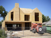 FILE - A new home under construction is seen, Aug. 21, 2023, in southeast Denver. On Thursday, April 11, 2024, Freddie Mac reports on this week&rsquo;s average U.S. mortgage rates.