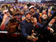 USC quarterback Caleb Williams celebrates among Chicago Bears fans after being chosen No.