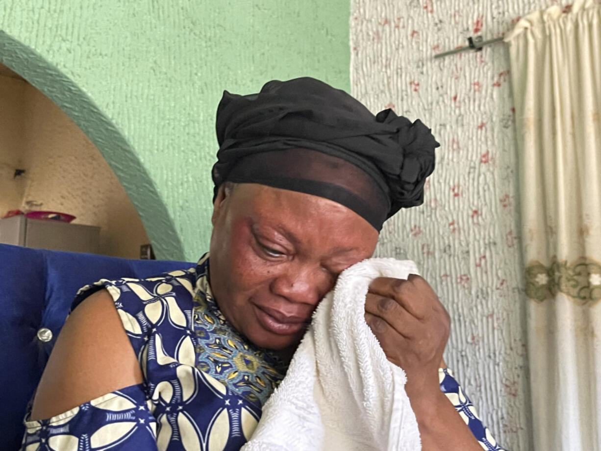 Mary Peter, mother of Jennifer Peter, who was kidnapped with others in her school by gunmen in March 2021, sobs during an interview with The Associated Press in Kaduna, Nigeria, Tuesday, March, 26, 2024. The gunmen who kidnapped Jennifer Peter and dozens of her peers from school in March 2021 returned months later to attack another school in her state in northwestern Nigeria. The second time, they seized over 100 children including Jennifer&rsquo;s 10-year-old cousin, Treasure, who was held captive for more than two years.