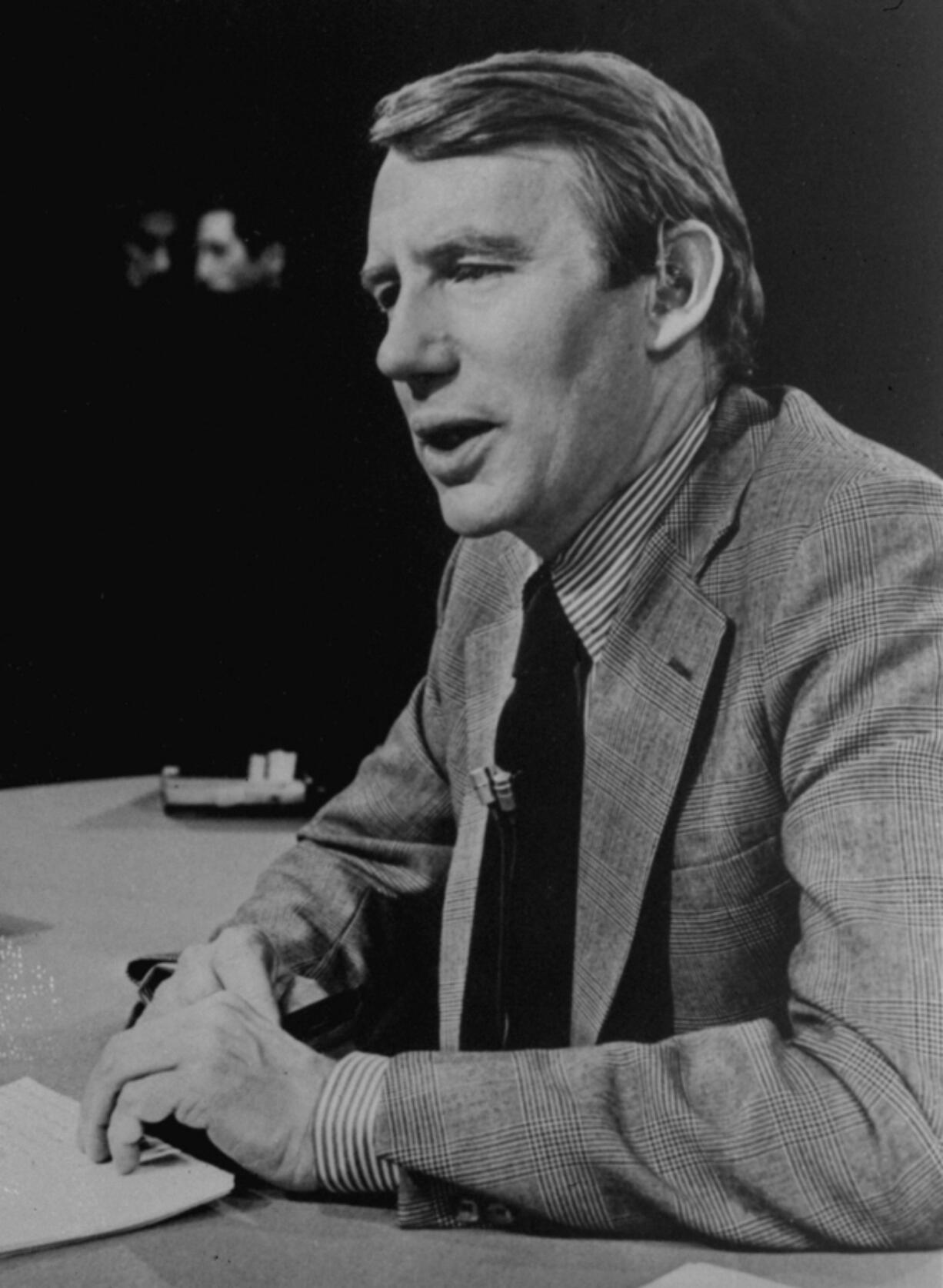 FILE - This Feb. 1978 photo shows Robert MacNeil,  executive editor of &quot;The MacNeil/Lehrer Report&quot;.  MacNeil, who created the even-handed, no-frills PBS newscast &ldquo;The MacNeil-Lehrer NewsHour&rdquo; in the 1970s and co-anchored the show for with his late partner, Jim Lehrer, for two decades, died on Friday, April 12, 2024. He was 93.