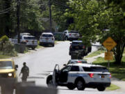 Police work at the scene of a shooting Monday in east Charlotte, N.C.